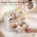 A white Delamu large makeup organizer with clear drawers and a retro fridge-style top compartment holding makeup brushes and