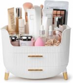 White HALAFE makeup organizer with two drawers and a top compartment, featuring gold accents and a ribbed texture.