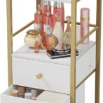 A gold and white HapiRm rolling makeup cart organizer with two fabric drawers, filled with various cosmetics and skincare pro