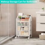 A white HapiRm rolling makeup cart organizer with three visible mesh drawers and a divided top section, filled with various b