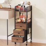 Black HapiRm rolling makeup cart organizer with wood accents, three fabric drawers, and a divided top section for cosmetics.