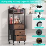 Black HapiRm rolling makeup cart organizer with wood accents, three fabric drawers, and a divided top section for cosmetics.