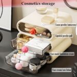 MavHubrix 3-Tier Cream White Makeup Organizer with colorful knobs on a vanity, holding cosmetics and small items.