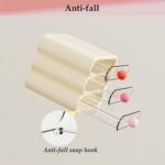 MavHubrix 3-Tier Cream White Makeup Organizer with colorful knobs on a vanity, holding cosmetics and small items.