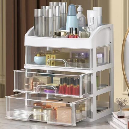 White PTBSZCWY makeup organizer with three pull-out drawers and an open top compartment for displaying cosmetics.