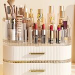 A cream white SpaceLuxe 3-tier makeup organizer with a rotating brush holder, filled with makeup and skincare products.