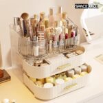 A cream white SpaceLuxe 3-tier makeup organizer with a rotating brush holder, filled with makeup and skincare products.