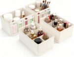 Set of four beige VERONLY fabric makeup organizer bins, with one rectangular bin showing adjustable dividers and three square
