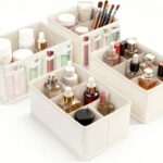 Set of four beige VERONLY fabric makeup organizer bins, with one rectangular bin showing adjustable dividers and three square