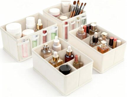 Set of four beige VERONLY fabric makeup organizer bins, with one rectangular bin showing adjustable dividers and three square