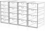 Four clear acrylic makeup organizers stacked and side-by-side, showcasing multiple drawers filled with various cosmetics and